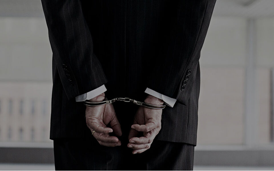 businessman handcuffed
